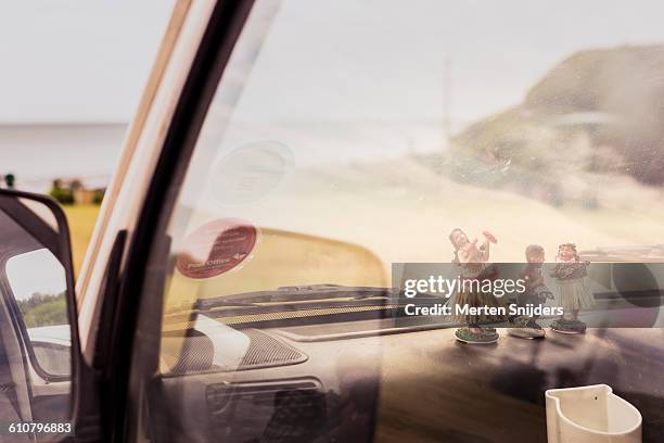 tiki dolls on car dashboard - tiki stock pictures, royalty-free photos & images