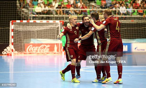Sergey Abramov of Russia celebrates his goal with team mates during the FIFA Futsal World Cup semi-final match between Iran and Russia at Coliseo...