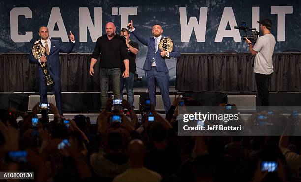 Lightweight champion Eddie Alvarez and UFC featherweight champion Conor McGregor interact with the media and fans during the UFC 205 press event at...