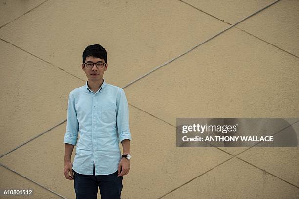 In this picture taken on September 12 23-year-old Nathan Law, Hong Kong's youngest ever lawmaker, poses after an interview with AFP at Lingnan...