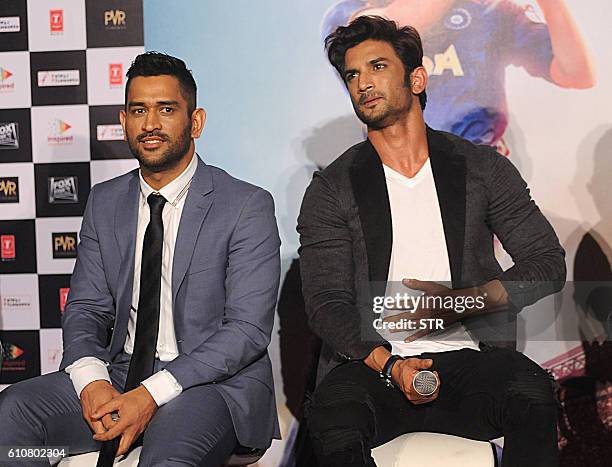 In this photograph taken on August 11 Indian Bollywood actor Sushant Singh Rajput and Indian cricket captain Mahendra Singh Dhoni pose during the...