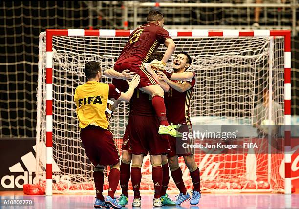 Russia players celebrate the win during the FIFA Futsal World Cup semi-final match between Iran and Russia at Coliseo Ivan de Bedout on September 27,...