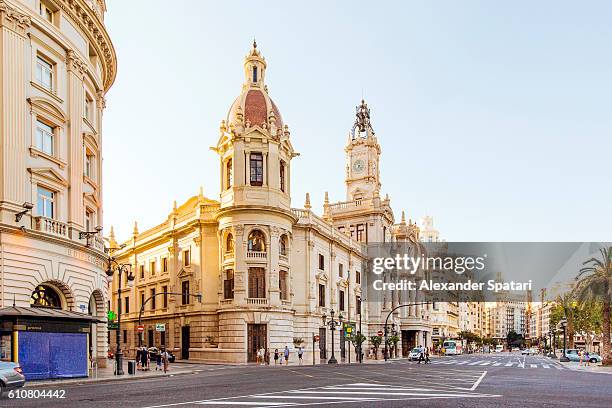 city street with view towards city hall, plaza del ayuntamiento, valencia, spain - spain city stock pictures, royalty-free photos & images