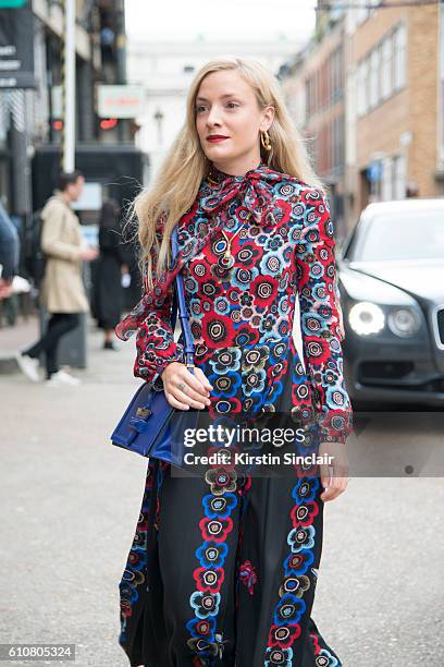 Fashion stylist Kate Foley wears a Valentino dress and a Fendi bag on day 5 of London Womens Fashion Week Spring/Summer 2016, on September 20, 2016...