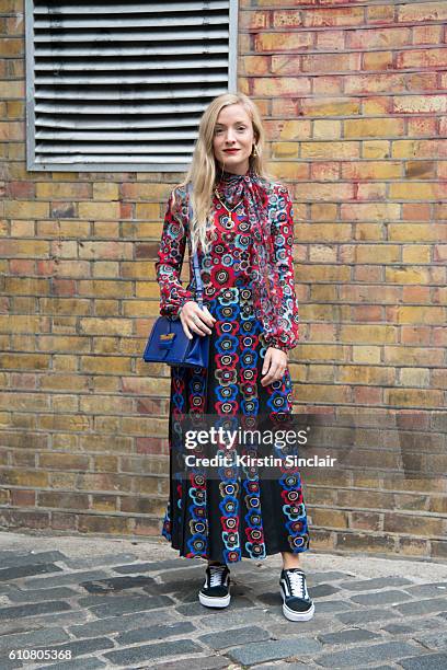 Fashion stylist Kate Foley wears a Valentino dress, Fendi bag and Vans trainers on day 5 of London Womens Fashion Week Spring/Summer 2016, on...