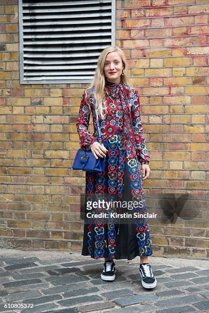 Fashion stylist Kate Foley wears a Valentino dress, Fendi bag and Vans trainers on day 5 of London Womens Fashion Week Spring/Summer 2016, on...