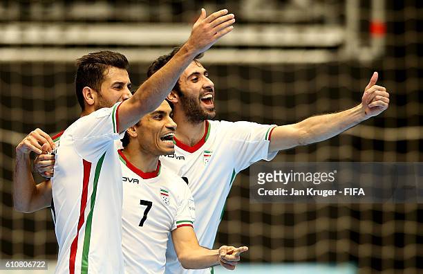 Ali Hassan Zadeh of Iran celebrates his goal with team mates during the FIFA Futsal World Cup semi-final match between Iran and Russia at Coliseo...