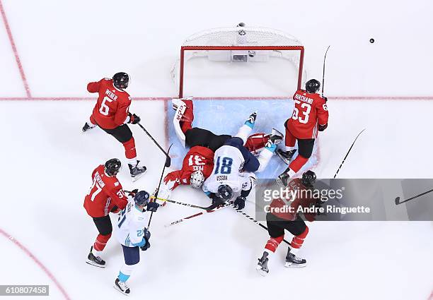 Marian Hossa of Team Europe collides with Carey Price of Team Canada during Game One of the World Cup of Hockey final series at the Air Canada Centre...