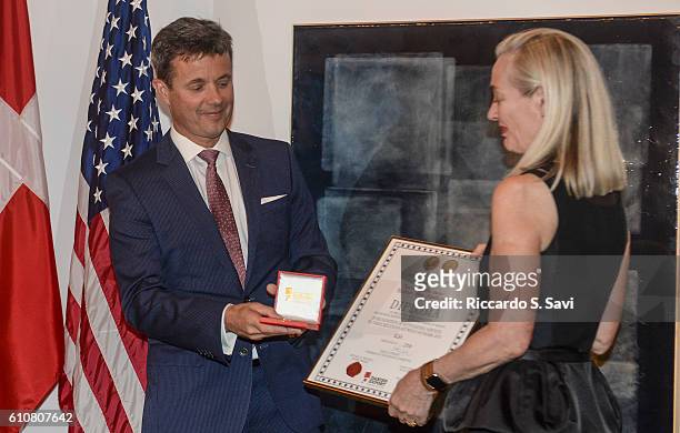 Crown Prince Frederick of Denmark presents the HRH Prins Henrik's Medal of Honor to Annette Rachlin on September 27, 2016 in Washington, DC.