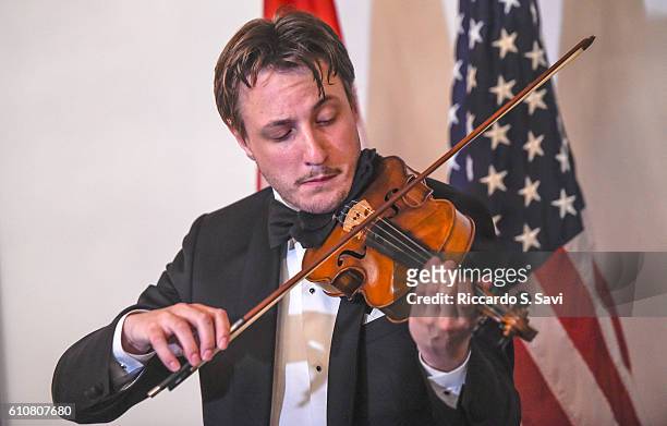 Violinist Nicolai Walentin performs before the presentation of the HRH Prins Henrik's Medal of Honor to Annette Rachlin on September 27, 2016 in...