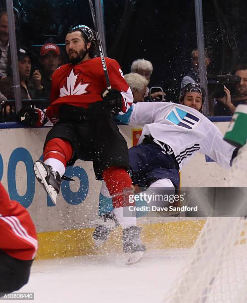 Drew Doughty of Team Canada throws a big hit on Frans Nielsen of Team Europe during Game One of the World Cup of Hockey 2016 final series at the Air...