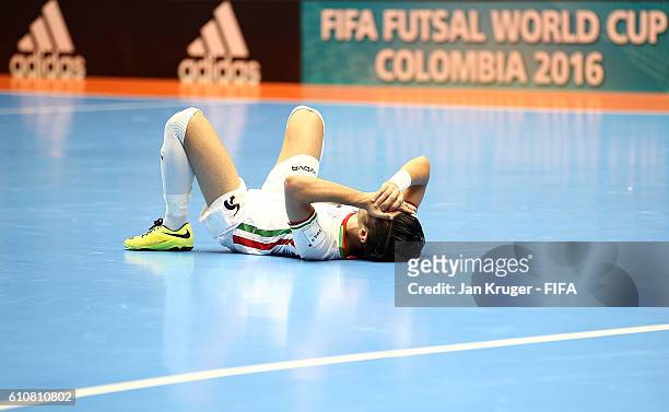 Hamid Ahmadi of Iran lies on the ground dejected after the final whistle during the FIFA Futsal World Cup semi-final match between Iran and Russia at...