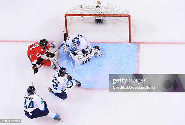 Brad Marchand of Team Canada scores against Jaroslav Halak of Team Europe as both Nino Niederreiter of Team Europe and Dennis Seidenberg of Team...