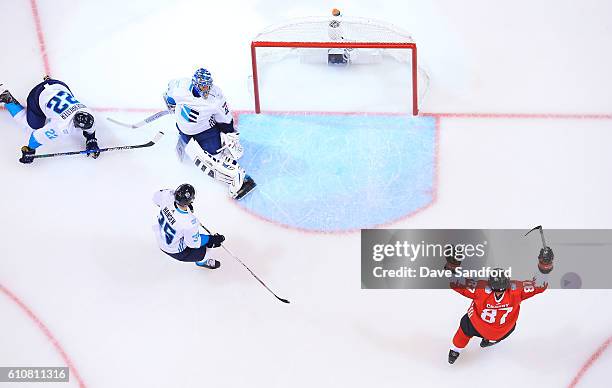 Sidney Crosby of Team Canada celebrates a goal by teammate Brad Marchand of Team Canada as Jaroslav Halak of Team Europe, Nino Niederreiter of Team...