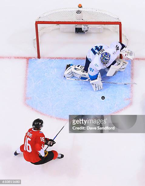 Jaroslav Halak of Team Europe makes a save as Jonathan Toews of Team Canada looks for the rebound during Game One of the World Cup of Hockey 2016...