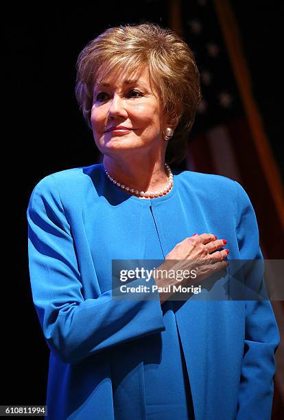 Sen. Elizabeth Dole stands at attendion during the singing of the U.S. National Anthem at the launch of the Elizabeth Dole Foundation's "Hidden...
