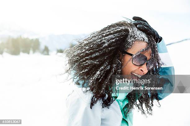 portrait of young woman in the snow - black snow stock pictures, royalty-free photos & images