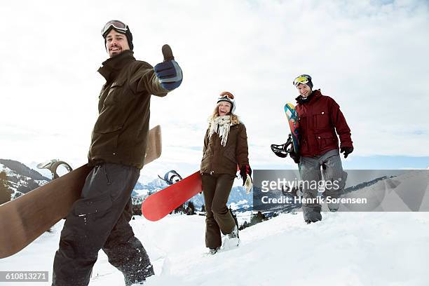young people on winter holiday - boarders stock pictures, royalty-free photos & images