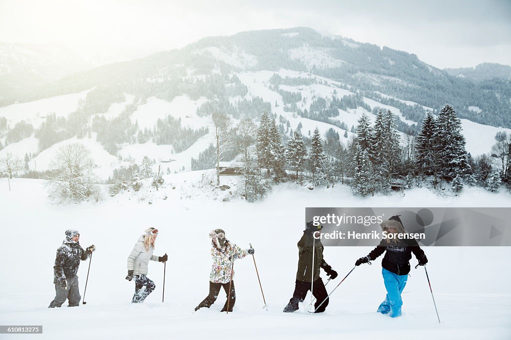 Line of young people on winter holiday