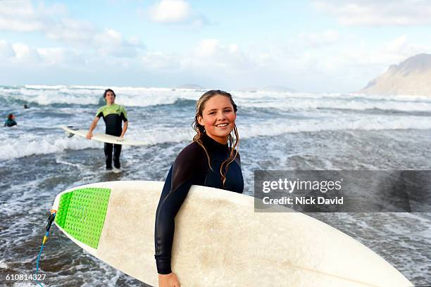 portrait of a surfer in the sea - travel16 stock pictures, royalty-free photos & images