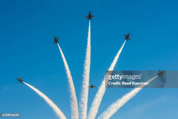 the blue angels perform at an air show. - airshow stockfoto's en -beelden