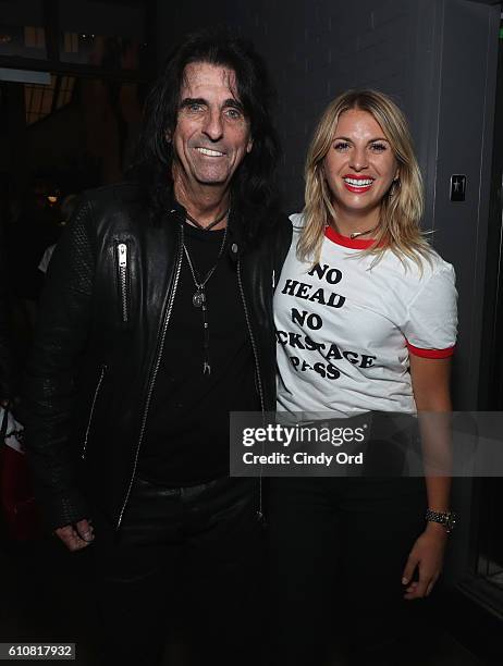 Alice Cooper and a guest wearing a Supermensch shirt attend as Alice Cooper, Shep Gordon and Shinola celebrate the release of Gordons Memoir, "They...