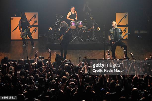 Robert Trujillo, Kirk Hammett, Lars Ulrich, and James Hetfield of the heavy metal band Metallica perform during a special Fifth Memember fan club...