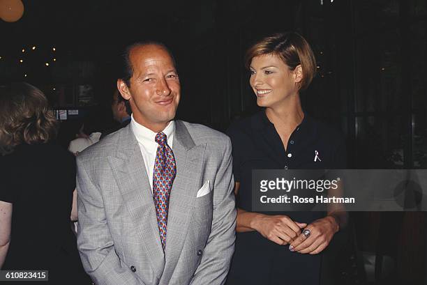 Canadian fashion model Linda Evangelista and American magazine executive Ron Galotti at a breast cancer awareness benefit, New York City, 1996.