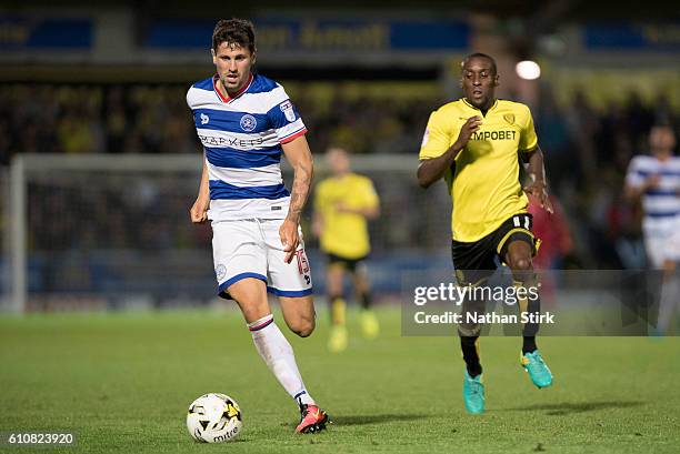 Pawel Wszolek of Queens Park Rangers and Lloyd Dyer of Burton Albion in action during the Sky Bet Championship match between Burton Albion and Queens...