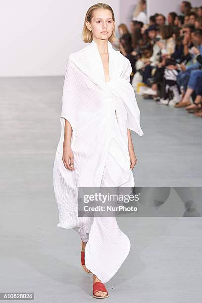 Model walks down the runway wearing Sid Neigum's spring/summer 17 collection at London Fashion Week on September 20th 2016