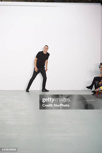 Model walks down the runway wearing Sid Neigum's spring/summer 17 collection at London Fashion Week on September 20th 2016