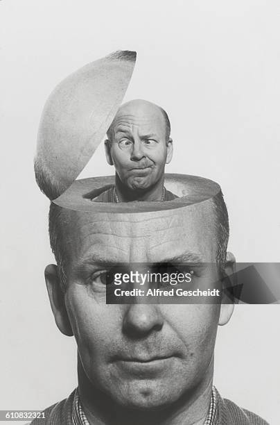 Man's head opens up to reveal a smaller version of himself inside, circa 1985.