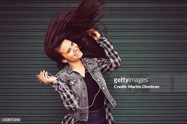 happy girl with mp3 player - throwing phone stock pictures, royalty-free photos & images