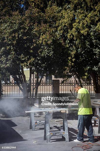 mexican worker cutting granite without any protection - respiratory protection construction stock pictures, royalty-free photos & images