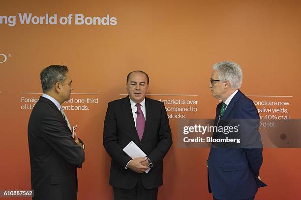 Anshu Jain, the former co-chief executive officer of Deutsche Bank AG, left, speaks with Axel Weber, chairman of UBS Group AG, and Adair Turner,...