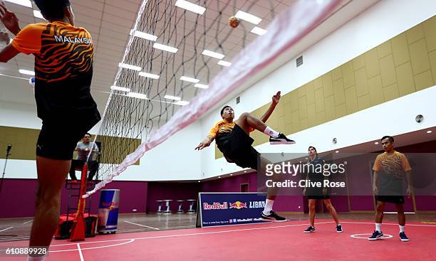 Max Verstappen of Netherlands and Red Bull Racing plays Malaysian sport sepak takraw at the iM4U Sentral in Puchong during previews for the Malaysia...