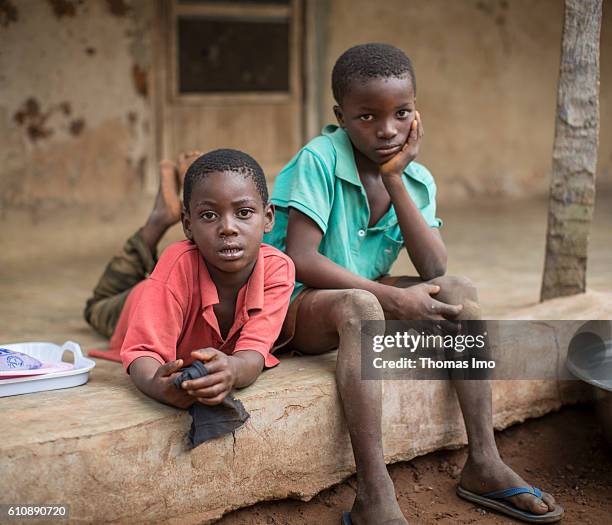 Congo, Ghana Portrait of two African children in front of a hut on a cashew farm on September 06, 2016 in Congo, Ghana.