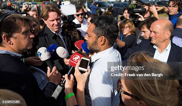 Relative of a MH17 victim talks to the press prior to the press conference of the Joint Investigation Team who presents the first results of its...