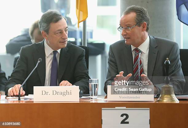 European Central Bank President Mario Draghi and Bundestag Europe Commission Chairman Gunther Krichbaum arrive at a session of the Commission on...