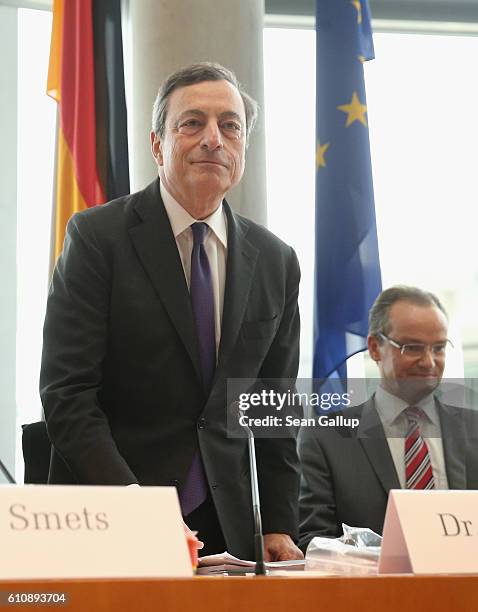 European Central Bank President Mario Draghi and Bundestag Europe Commission Chairman Gunther Krichbaum arrive at a session of the Commission on...