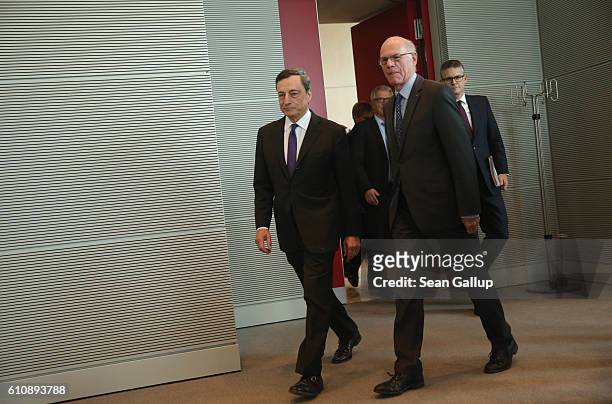 European Central Bank President Mario Draghi and Bundestag President Norbert Lammert arrive for talks at the Bundestag on September 28, 2016 in...