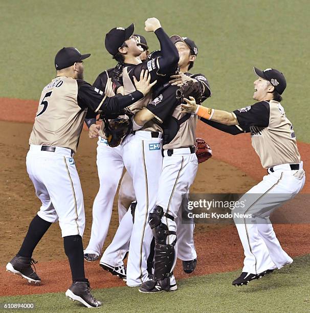 Nippon Ham Fighters ace pitcher Shohei Otani expresses joy with his teammates as his team clinched the Pacific League pennant at Seibu Prince Dome...