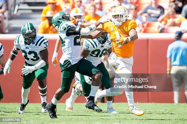 Running back Jalen Hurd of the Tennessee Volunteers stiff arms safety Toran Davis of the Ohio Bobcats at Neyland Stadium on September 17, 2016 in...