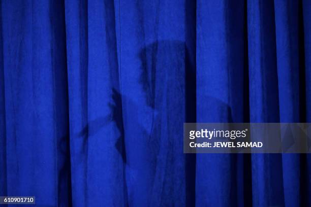 Republican presidential nominee Donald Trump casts a shadow as he speaks at the Polish National Alliance in Chicago, Illinois, on September 28, 2016.
