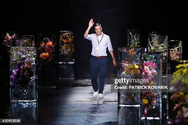 Belgian fashion designer Dries Van Noten acknowledges the audience at the end of his 2017 Spring/Summer ready-to-wear collection fashion show, on...