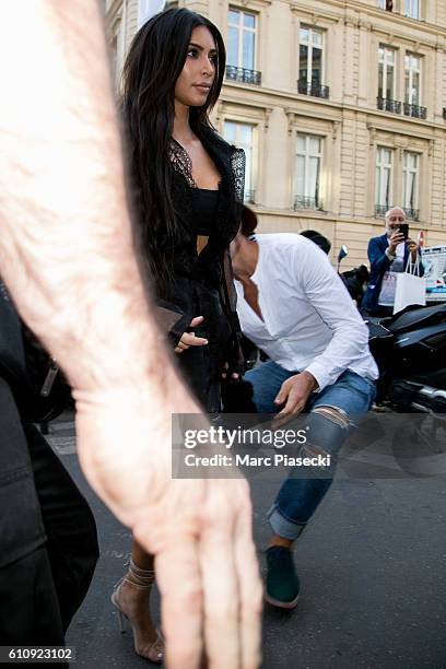 Vitalii Sediuk jumps on Kim Kardashian West as she arrives at 'L'Avenue' restaurant on September 28, 2016 in Paris, France.