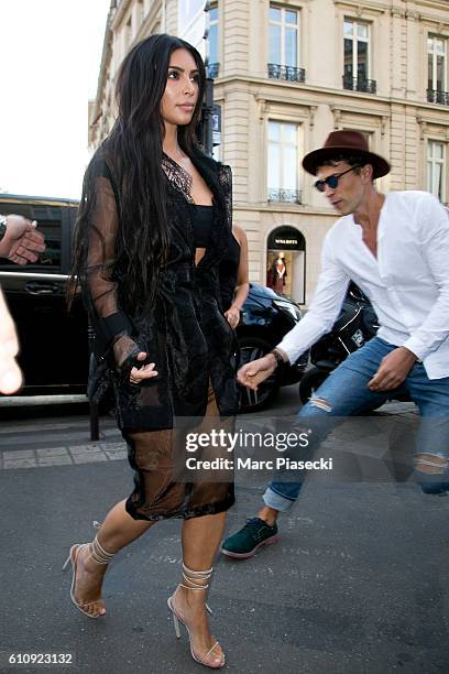 Vitalii Sediuk jumps on Kim Kardashian West as she arrives at 'L'Avenue' restaurant on September 28, 2016 in Paris, France.