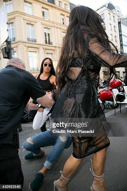 Vitalii Sediuk jumps on Kim Kardashian West as she arrives at 'L'Avenue' restaurant on September 28, 2016 in Paris, France.
