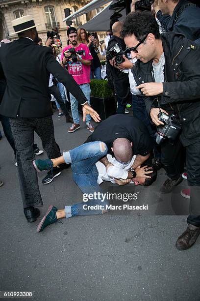 Bodyguard Pascal Duvier immobilizes Vitalii Sediuk after jumping on Kim Kardashian West at 'L'Avenue' restaurant on September 28, 2016 in Paris,...