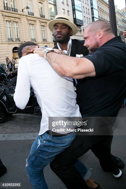 Bodyguard Pascal Duvier and french security agent immobilize Vitalii Sediuk after jumping on Kim Kardashian West at 'L'Avenue' restaurant on...